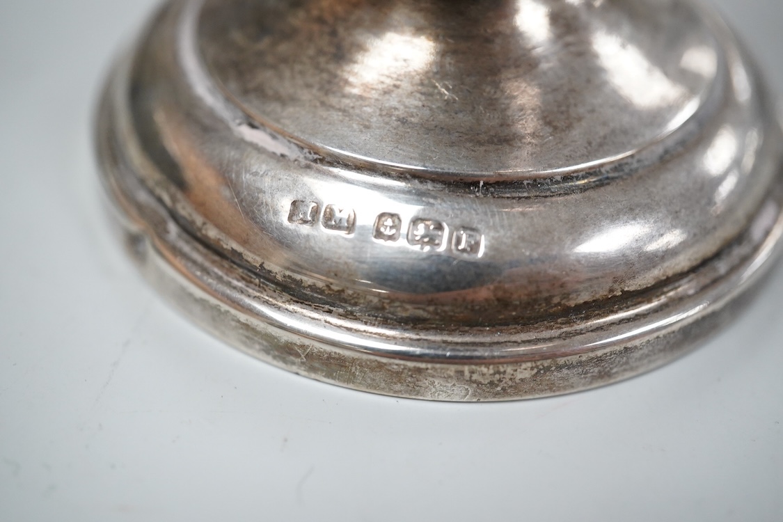 A George V silver tall cream jug, Birmingham, 1930, 17.2cm, a 1950's silver small mug, London, 1955 and a cased 1930's silver three piece condiment set.